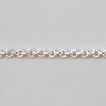 Silver chain bracelet on a light gray background