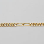 Gold chain on a light gray background