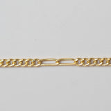 Gold chain on a light gray background