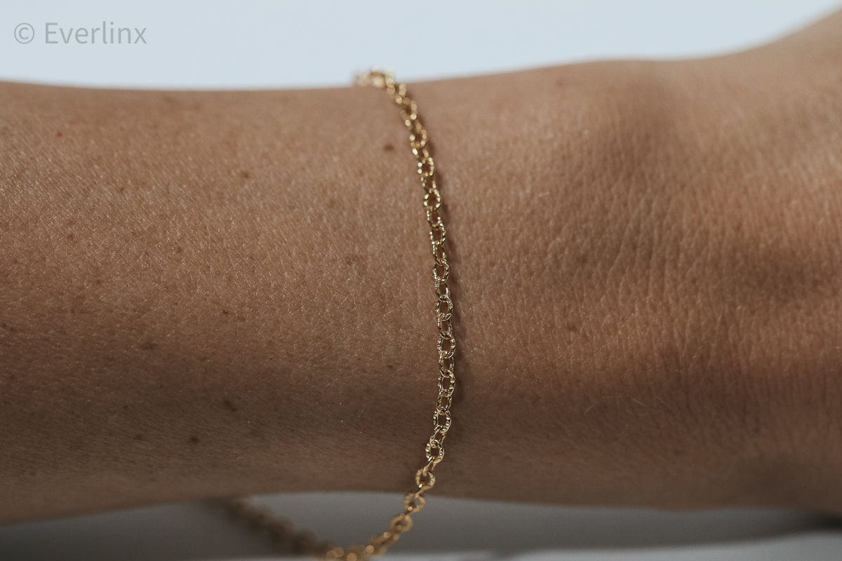 Gold chain bracelet on wrist