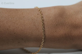 Gold chain bracelet on wrist