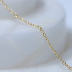 Gold chain necklace detail